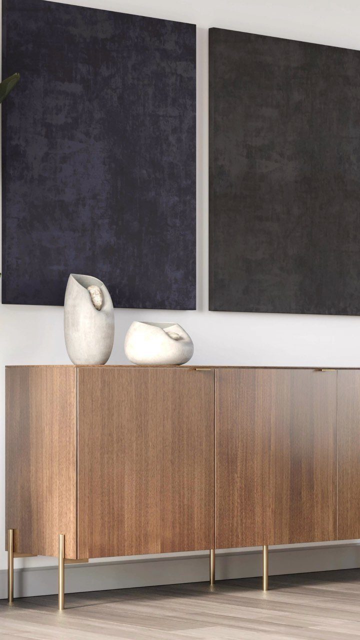 Dark Brown Wood Colors: 13 Ideas for Your Home 10 A modern wooden sideboard with gold legs and white ceramic decor against a white wall.