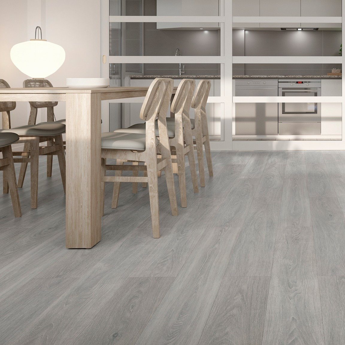 Light gray wood flooring in a bright, modern dining room and kitchen area.