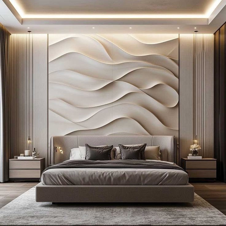A modern bedroom with a large beige 3D wavy textured accent wall behind a grey bed.