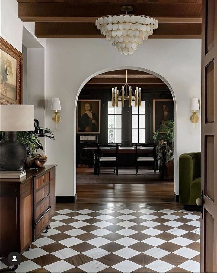 Art Deco Wood Floor: 5 Ways to Bring the Style Home 5 Geometric diamond patterned floor tiles in white and dark wood in a hallway leading to a dining room.